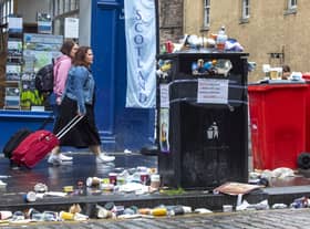 Bins have been overflowing after a busy Fringe weekend in Edinburgh as cleansing staff continue their strike. (Credit: SWNS)