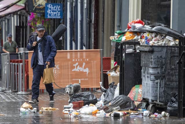 Cleansing staff are battling for a better pay deal as rubbish mounts up on Edinburgh’s streets. (Credit: SWNS)