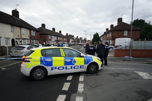A police cordon at the scene in Knotty Ash, Liverpool, where a nine-year-old girl has been fatally shot. Credit: PA