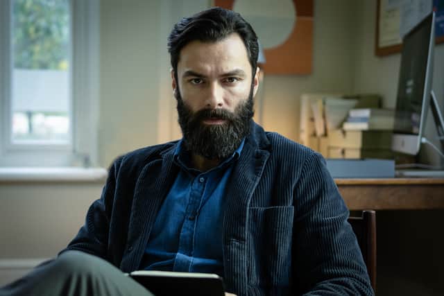 Aidan Turner as Doctor Joe O’Loughlin, sat in his office and giving the viewer a cold, intimidating stare (Credit: ITV)