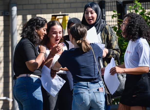 <p>Students react after opening their GCSE exam results on GCSE results day at the City of London Academy, Hackney (Pic: Getty Images)</p>