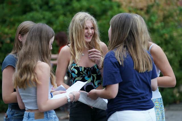 Kaitlin Wolmarans (centre) with other students after they received his GCSE results at Norwich School. Credit: PA