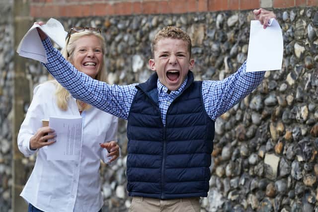 Finney Harrod receiving his GCSE results at Norwich School. Credit: PA