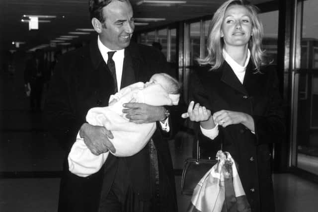  Australian businessman and media tycoon Rupert Murdoch with his wife, Anna and their baby daughter, Elizabeth, at London Airport in 1968.  (Photo by Evening Standard/Getty Images)