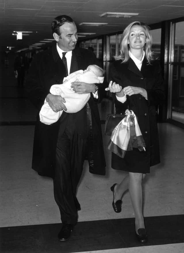  Australian businessman and media tycoon Rupert Murdoch with his wife, Anna and their baby daughter, Elizabeth, at London Airport in 1968.  (Photo by Evening Standard/Getty Images)