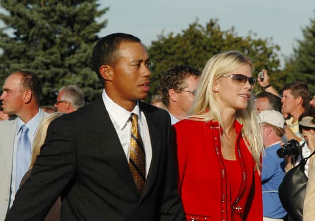 Tiger Woods  and his girlfriend, Elin Nordegren,   leave the stage after  opening ceremonies at the 2004 Ryder Cup in Detroit, Michigan, September 16, 2004. (Photo by A. Messerschmidt/Getty Images)