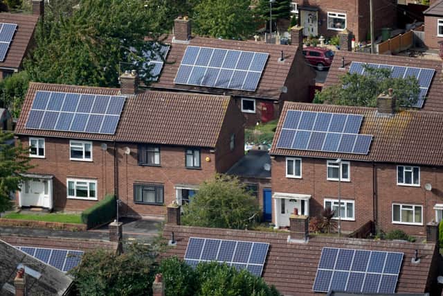 Solar panels adorn the roofs of homes on September 27, 2021 in Runcorn, England (Photo by Christopher Furlong/Getty Images)