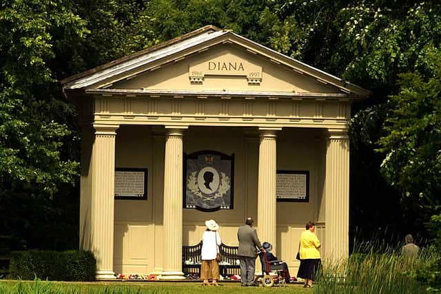 Visitors look at the Diana Shrine June 28, 2001 on Oval Lake as Althorp Estate is re-opened to the public in Great Brington, outside London, UK. (Photo by Sion Touhig/Getty Images)