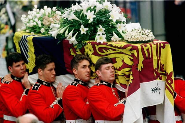 The coffin of Diana, Princess of Wales, is carried into Westminster Abbey 06 September. (Photo by RUSSELL BOYCE/AFP via Getty Images)