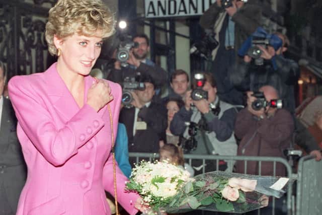 Picture dated 14 November 1992 of Princess Diana leaving the first anti-AIDS bookshop in Paris (Photo by VINCENT AMALVY/AFP via Getty Images)
