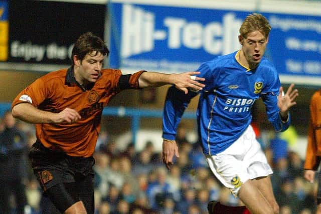 17 Jan 2002:  Peter Crouch of Portsmouth gets away from Paul Butler of Wolves during the Nationwide First Division match between Portsmouth and Wolverhampton Wanderers at Fratton Park, Portsmouth. (Photo: Mike Hewitt/Getty Images)