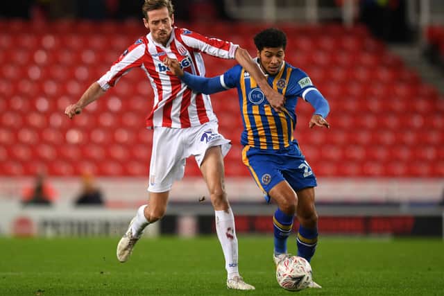 Peter Crouch of Stoke City and Josh Laurent of Shrewsbury Town in action during the FA Cup Third Round Replay match between Stoke City and Shrewsbury Town at Bet365 Stadium on January 15, 2019 in Stoke on Trent, United Kingdom. (Photo by Gareth Copley/Getty Images)