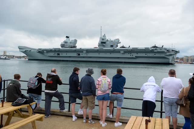 People watch the HMS Prince of Wales depart from Portsmouth, England (Pic: Getty Images)