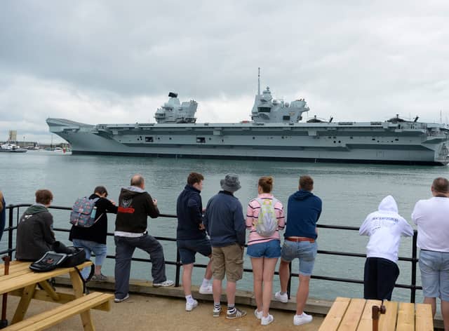 People watch the HMS Prince of Wales depart from Portsmouth, England (Pic: Getty Images)
