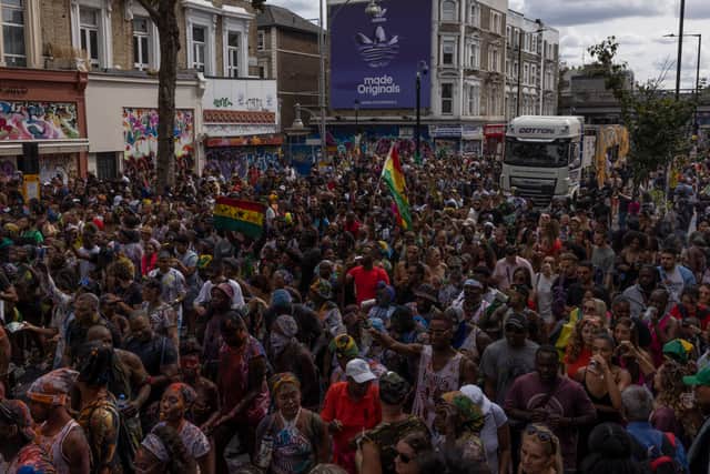 Revellers process down the route during the Notting Hill carnival on August 28, 2022 in London (Getty Image)