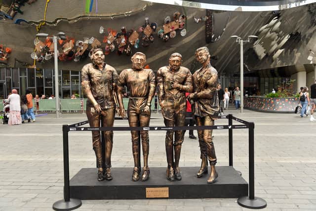 Birmingham Artist William Douglas AKA Tat Vision unveils his sculpture ‘Four Lads in Jeans’ outside All Bar One at Grand Central in Birmingham City Centre (Photo: SWNS)
