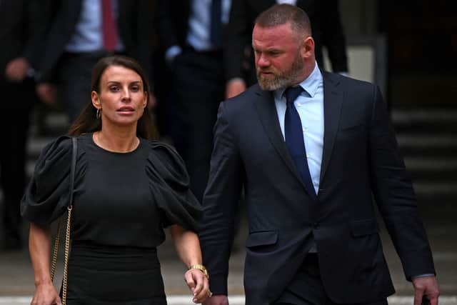 Coleen Rooney and Wayne Rooney leave the High Court in central London on May 12, 2022. (Photo by DANIEL LEAL/AFP via Getty Images)