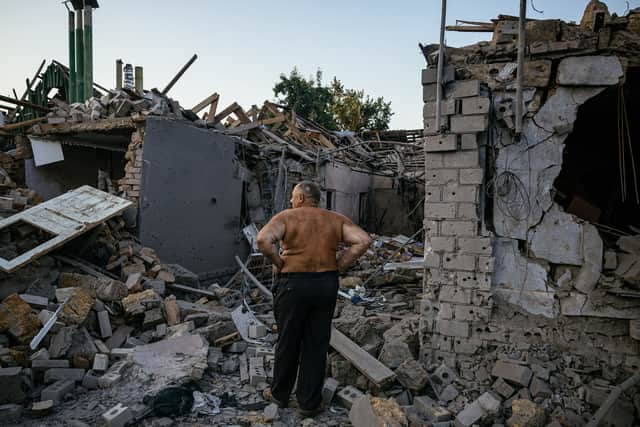 Oleksandr Shulga looks at his destroyed house following a missile strike in Mykolaiv (Pic: AFP via Getty Images)