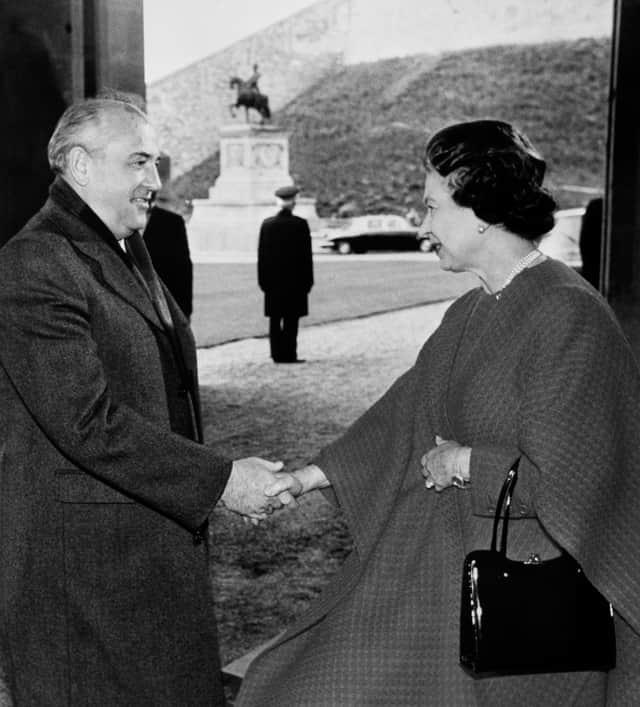 Soviet President Mikhail Gorbachev being greeted by Queen Elizabeth II at the entrance to Windsor Castle. Credit: PA