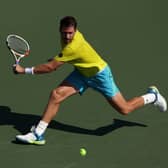 Norrie reaches second round after defeat over Benoit Paire