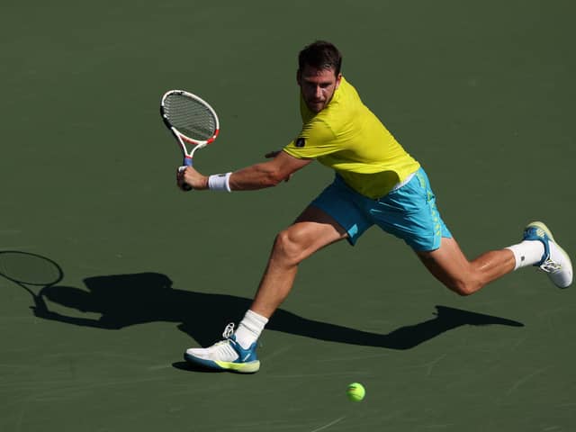 Norrie reaches second round after defeat over Benoit Paire