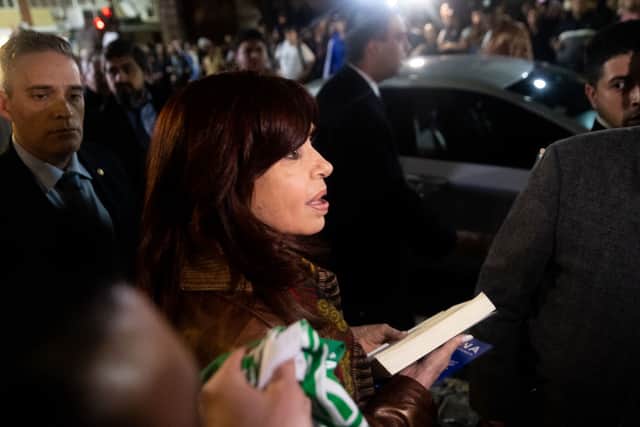 Vice President of Argentina Cristina Fernandez talks to supporters that waited for at her home at Recoleta neighborhood after opening a session at the National Congress in Buenos Aires, Argentina. A man pointed a gun at her. Credit: Tomas Cuesta/Getty Images