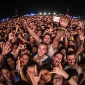 Fans react during Arctic Monkeys concert. (Photo by Santiago Bluguermann/Getty Images)
