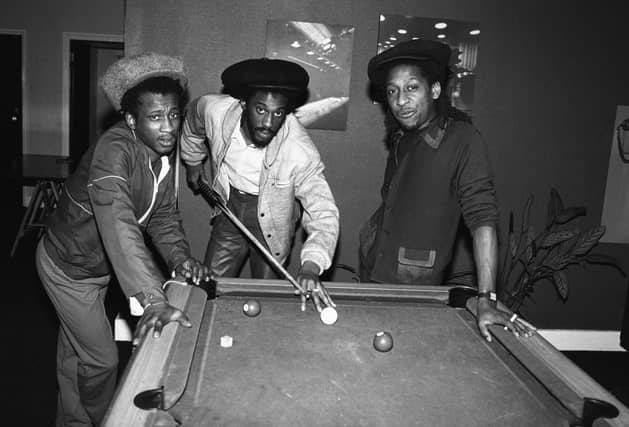 Aswad (Brinsley Forde, Tony Robinson and Angus Gaye), British reggae band, pictured playing pool, 8th March 1984. Drummie Zeb’s death was announced in September 2022. He was 62 years old.