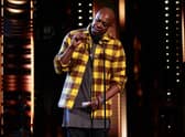 CLEVELAND, OHIO - OCTOBER 30: Dave Chappelle speaks onstage during the 36th Annual Rock & Roll Hall Of Fame Induction Ceremony at Rocket Mortgage Fieldhouse on October 30, 2021 in Cleveland, Ohio. (Photo by Dimitrios Kambouris/Getty Images for The Rock and Roll Hall of Fame )