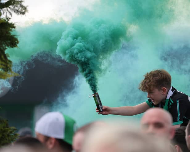  Celtic fans with their smoke bombs. (Photo by Steve  Welsh/Getty Images)