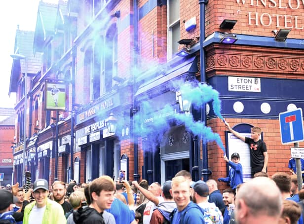 <p>LIVERPOOL, ENGLAND - SEPTEMBER 03: Fans of Everton enjoy the pre match atmosphere prior to the Premier League match between Everton FC and Liverpool FC at Goodison Park on September 03, 2022 in Liverpool, England. (Photo by Laurence Griffiths/Getty Images)</p>