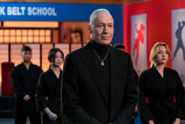 Thomas Ian Griffith as Terry Silver and Peyton List as Tory Nichols in Cobra Kai S5. They’re wearing black karate uniforms and stood in a dojo (Credit: Curtis Bonds Baker/Netflix)