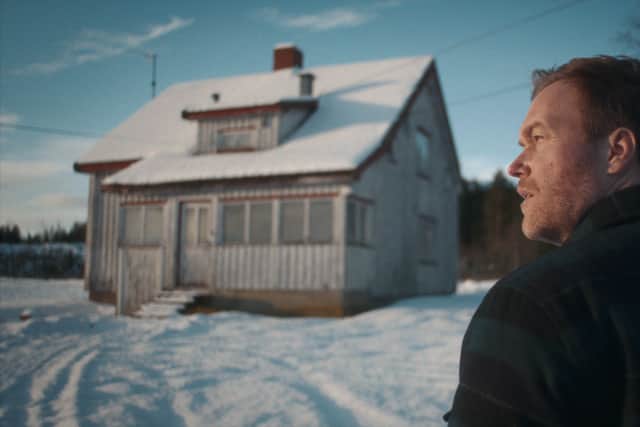 Christian Rubeck in The Lørenskog Disappearance, turning away from a snowy cottage (Credit: John-Erling H. Fredriksen/Netflix)