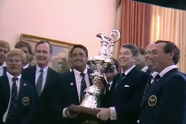 President Reagan and the crew of the Stars and Stripes boating team at the White House, holding a trophy aloft (Credit: Netflix)