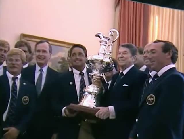 President Reagan and the crew of the Stars and Stripes boating team at the White House, holding a trophy aloft (Credit: Netflix)