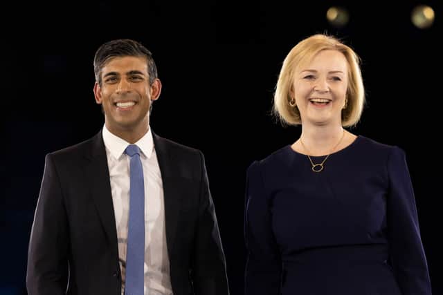 Liz Truss and Rishi Sunak appear together at the end of the final Tory leadership hustings at Wembley Arena on August 31, 2022 in London  (Photo by Dan Kitwood/Getty Images)