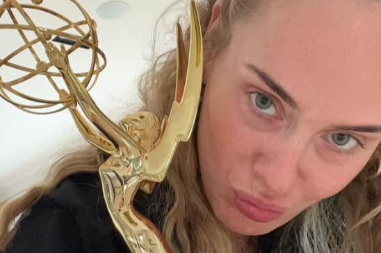 Adele with her new Emmy award which she won this weekend. 
