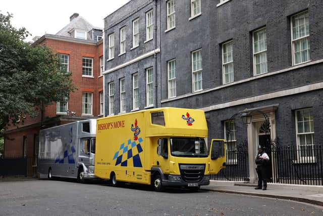 Moving trucks are parked outside Number 10 and 11 Downing Street (Pic: AFP via Getty Images)