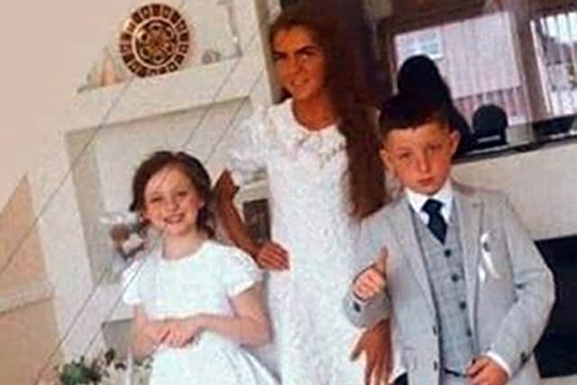 A family photo issued by An Garda Siochana of Lisa Cash, 18, and her two younger siblings, eight-year-old twins Christy and Chelsea Cawley