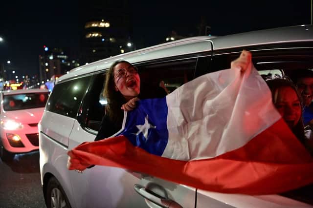 <p>People rejecting the new constitution draft celebrate after learning the results of the partial vote of the referendum (Photo: MARTIN BERNETTI/AFP via Getty Images)</p>