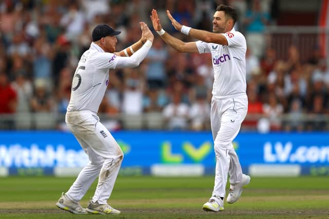 James Anderson (right) and Ben Stokes celebrate the wicket of Kagiso Rabada