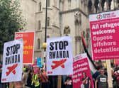 Demonstrators outside the Royal Courts of Justice, central London, protesting against the Government’s plan to send some asylum seekers to Rwanda.