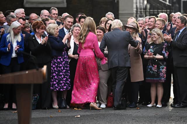 Boris Johnson and Carrie Johnson greet Conservative party members after his farewell address before his official resignation at Downing Street. (Photo by Leon Neal/Getty Images)