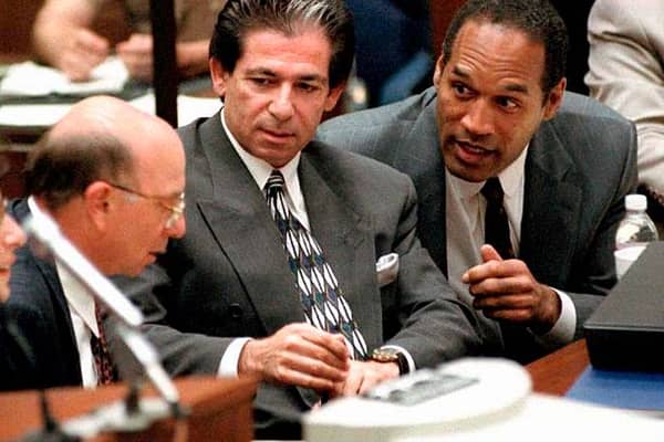OJ Simpson, right, during his murder trial in the 1990s. (Picture: AFP via Getty Images)