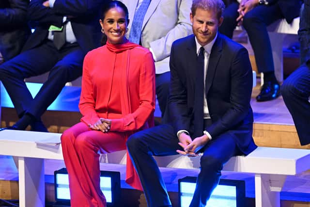Britain's Meghan, Duchess of Sussex and Britain's Prince Harry, Duke of Sussex, react as they attend the annual One Young World Summit at Bridgewater Hall in Manchester, north-west England on September 5, 2022.