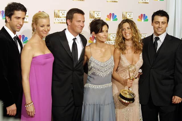 Cast members from “Friends,” which won Outstanding Comedy, series - pose at the 54th Annual Emmy Awards at the Shrine Auditorium in Los Angeles 22 September 2002.  From L to R are David Schwimmer, Lisa Kudrow, Mathew Perry, Courtney Cox Arquette, Jennifer Aniston and Matt LeBlanc. (Photo credit LEE CELANO/AFP via Getty Images)