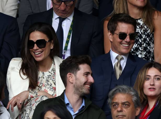 <p>Tom Cruise (R) and English actor Hayley Atwell (L) were all smiles at Wimbledon (Pic: AFP via Getty Images)</p>