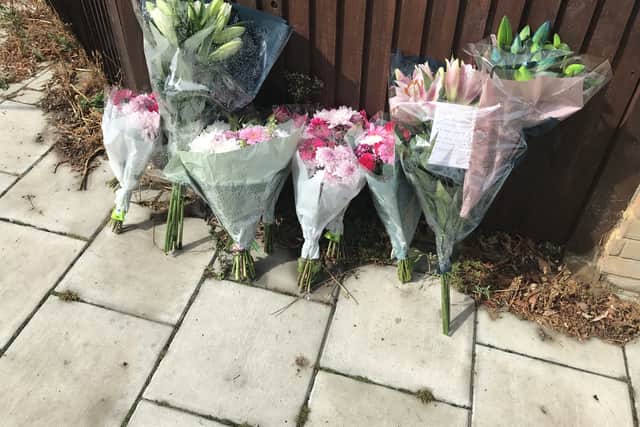 Floral tributes at the scene in Kirkstall Gardens, Streatham Hill, south London, where rapper Chris Kaba was shot by armed officers from the Metropolitan Police following a pursuit on Monday evening. Mr Kaba, who was due to become a father within months, died in hospital after one round was fired from a police weapon. Picture date: Wednesday September 7, 2022.