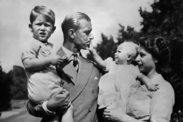 Undated picture showing the Royal British couple, Britain's Queen Elizabeth II, and her husband Britain's Prince Philip, Duke of Edinburgh, with their two children, Charles, Prince of Wales (L) and Princess Anne (R). (