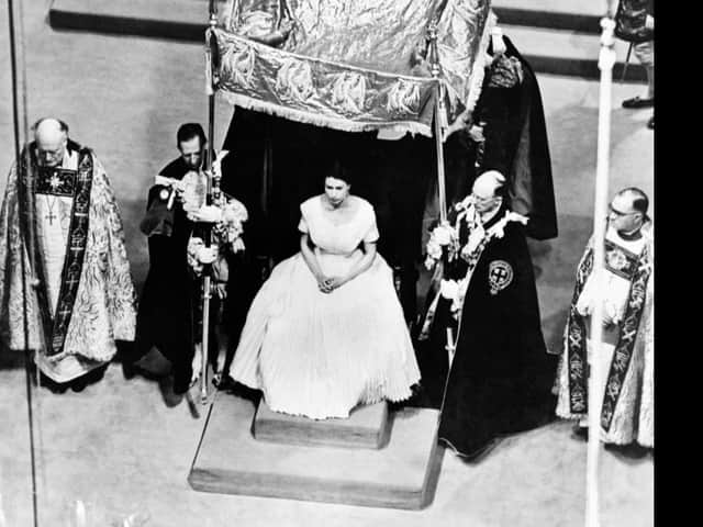 A canopy of cloth of gold is placed over Elizabeth II by the four Garter Knights prior to her anointing by the Archbishop of Canterbury at coronation ceremonies in London's Westminster Abbey, on June 2, 1953